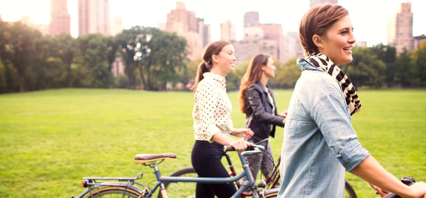 img_people-in-city-with-bikes-1440x670